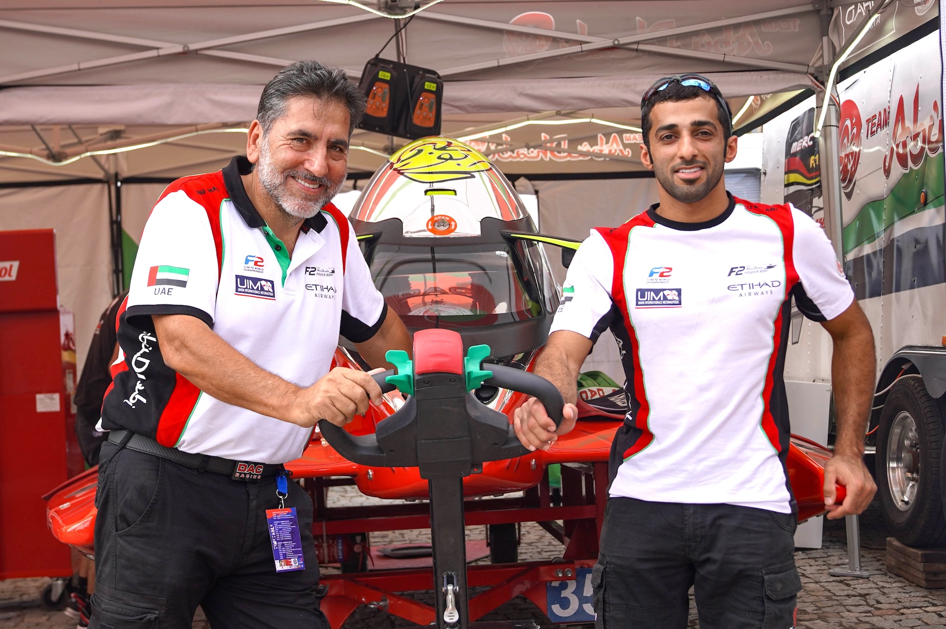 Rashed Al-Qemzi (left) with Team Abu Dhabi manager Guido Cappellini (Supplied)