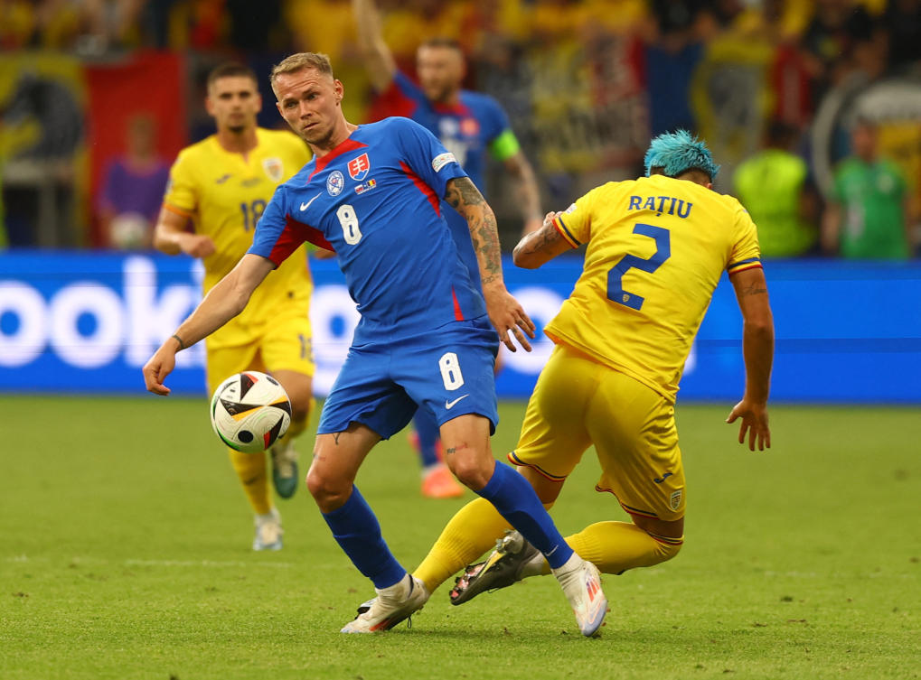 Slovakia’s Ondrej Duda in action with Romania’s Andrei Ratiu during their Euro 2024 — Group E match at Frankfurt Arena, Frankfurt, on Jun. 26, 2024. (Reuters)
