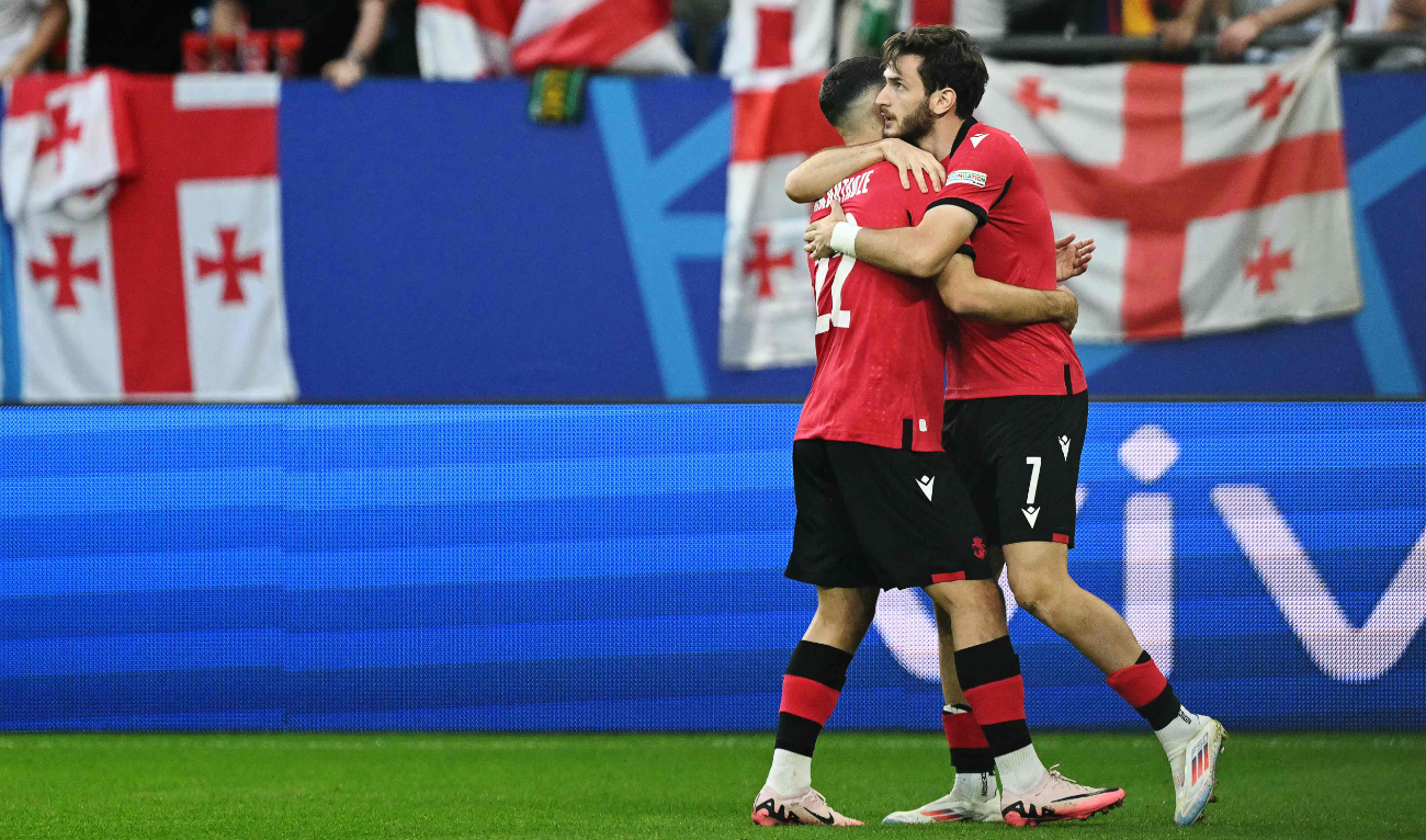 Georgia’s forward #07 Khvicha Kvaratskhelia (R) celebrates with teammate #22 Georges Mikautadze after scoring his team’s first goal during the UEFA Euro 2024 Group F football match between against Portugal at the Arena AufSchalke in Gelsenkirchen on June 26, 2024. (AFP)