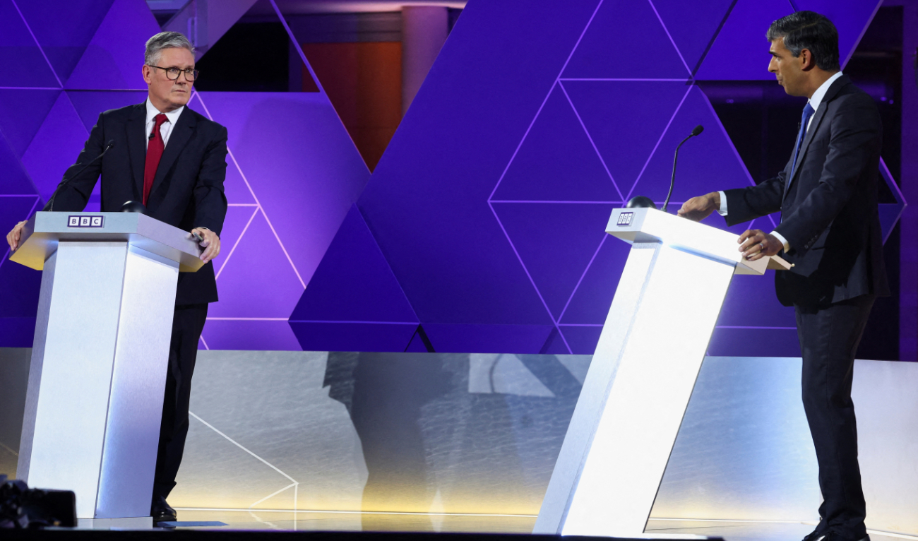 Britain’s Prime Minister and Conservative Party leader Rishi Sunak, and Labour Party leader Keir Starmer attend a live TV debate, hosted by The BBC, in Nottingham, on June 26, 2024, in the build-up to the UK general election on July 4. (AFP)