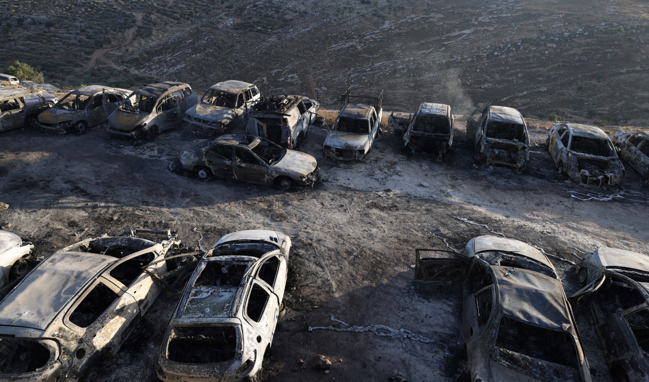 A view of burnt out vehicles stationed in a car park following a reported Israeli settlers attack in the town of Burqah, east of the West Bank city of Ramallah on June 7, 2024. (AFP/File)