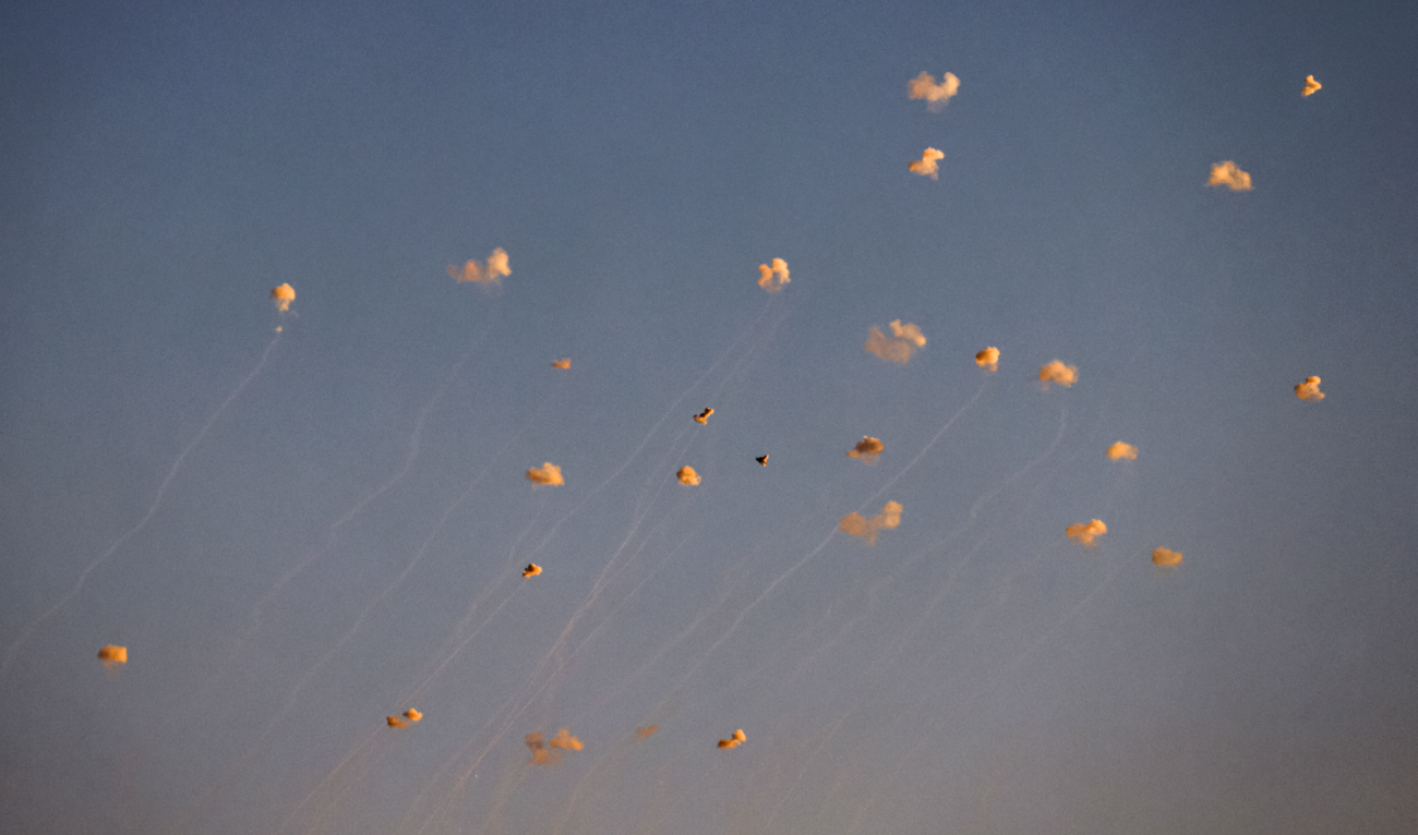 Rockets fired from southern Lebanon are intercepted by Israel’s Iron Dome air defense system over the Upper Galilee region in northern Israel on June 27, 2024. (AFP/File)