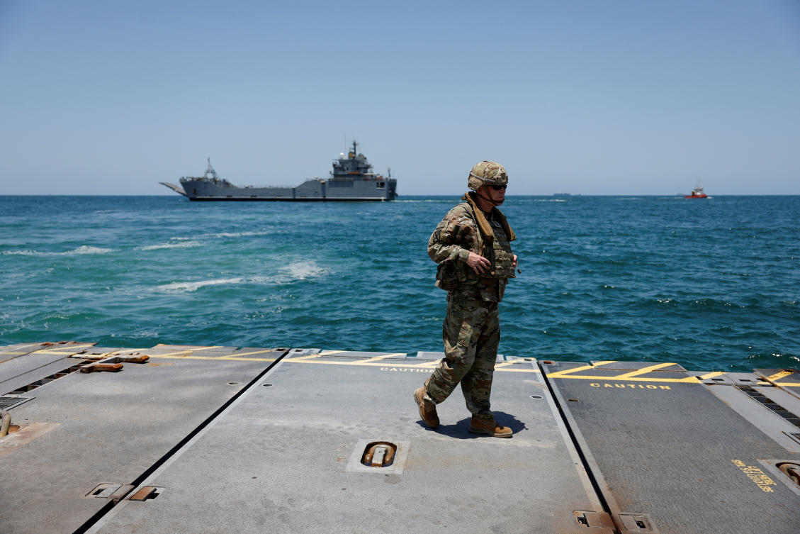A soldier stands at Trident Pier, a temporary pier to deliver aid off the Gaza Strip, near the Gaza coast, on June 25, 2024. (Reuters)