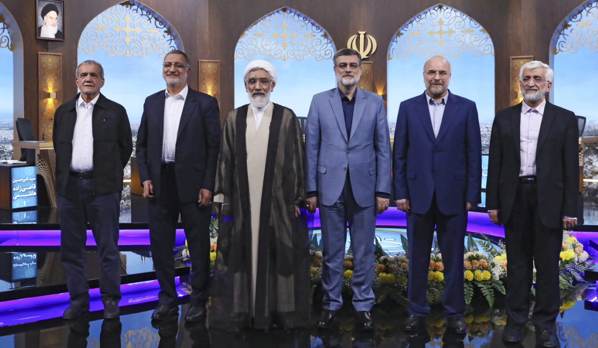 In this picture made available by Iranian state-run TV, IRIB, presidential candidates for June 28, election from left to right: Masoud Pezeshkian, Alireza Zakani, Mostafa Pourmohammadi, Amirhossein Ghazizadeh Hashemi, Mohammad Bagher Qalibaf, and Saeed Jalili pose for a photo after the conclusion of their debate at the TV studio in Tehran, Iran, Tuesday, June 25, 2024. (AP)