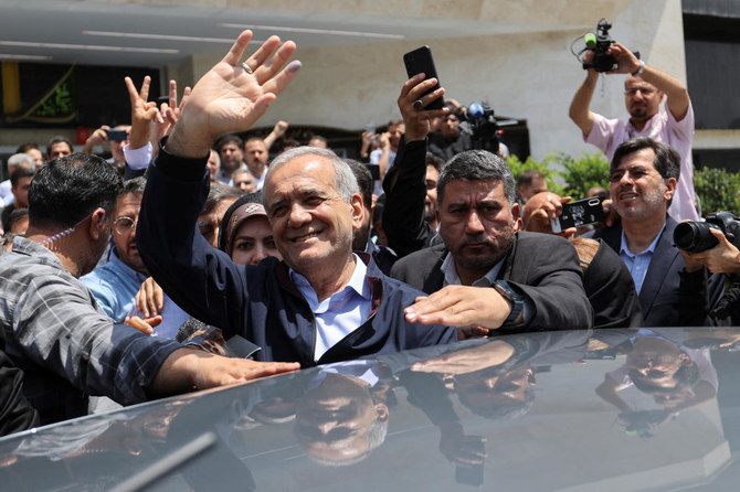 Presidential candidate Masoud Pezeshkian waves to supporters on the day of the presidential election to choose a successor to Ebrahim Raisi following his death in a helicopter crash, in Tehran, Iran June 28, 2024. (REUTERS)