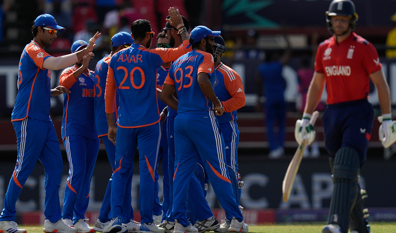 India’s Axar Patel (20) celebrates with teammates after the dismissal of England’s captain Jos Buttler, right, during the ICC Men’s T20 World Cup second semifinal cricket match between England and India at the Guyana National Stadium in Providence, Guyana, Thursday, June 27, 2024. (AP)