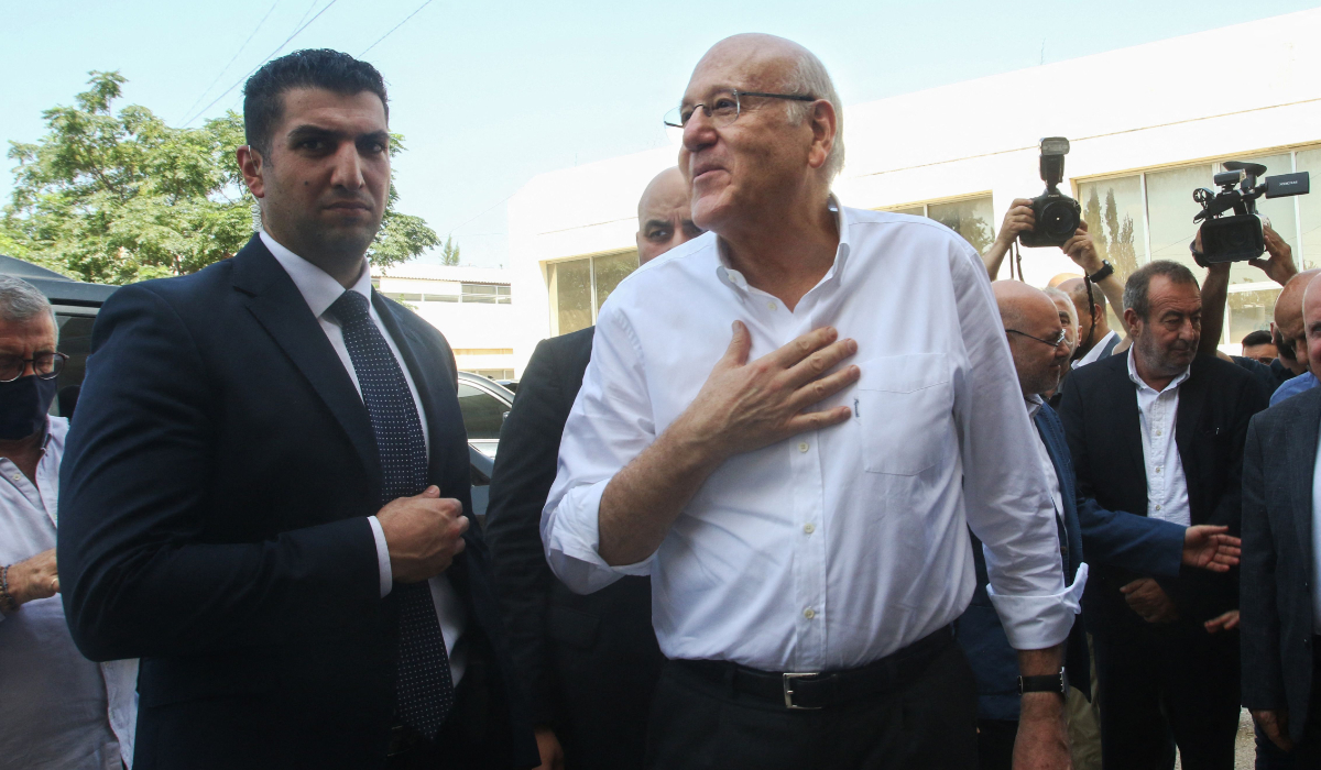 Lebanon's Prime Minister Najib Mikati (C) arrives at the crisis management operations room in the southern Lebanese port city of Tyre where he met on June 29, 2024 emergency and paramedic teams dealing with people displaced from villages further south near the border with Israel. (AFP)