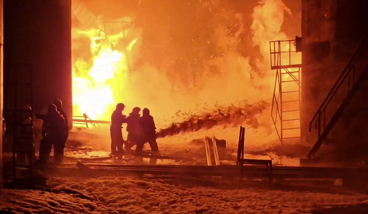 This grab from a handout footage published on the official Telegram account of the governor of the Kursk region Roman Starovoit on February 15, 2024, shows firefighters working to extinguish a fire at an oil depot in the Kursk region. (AFP file photo)