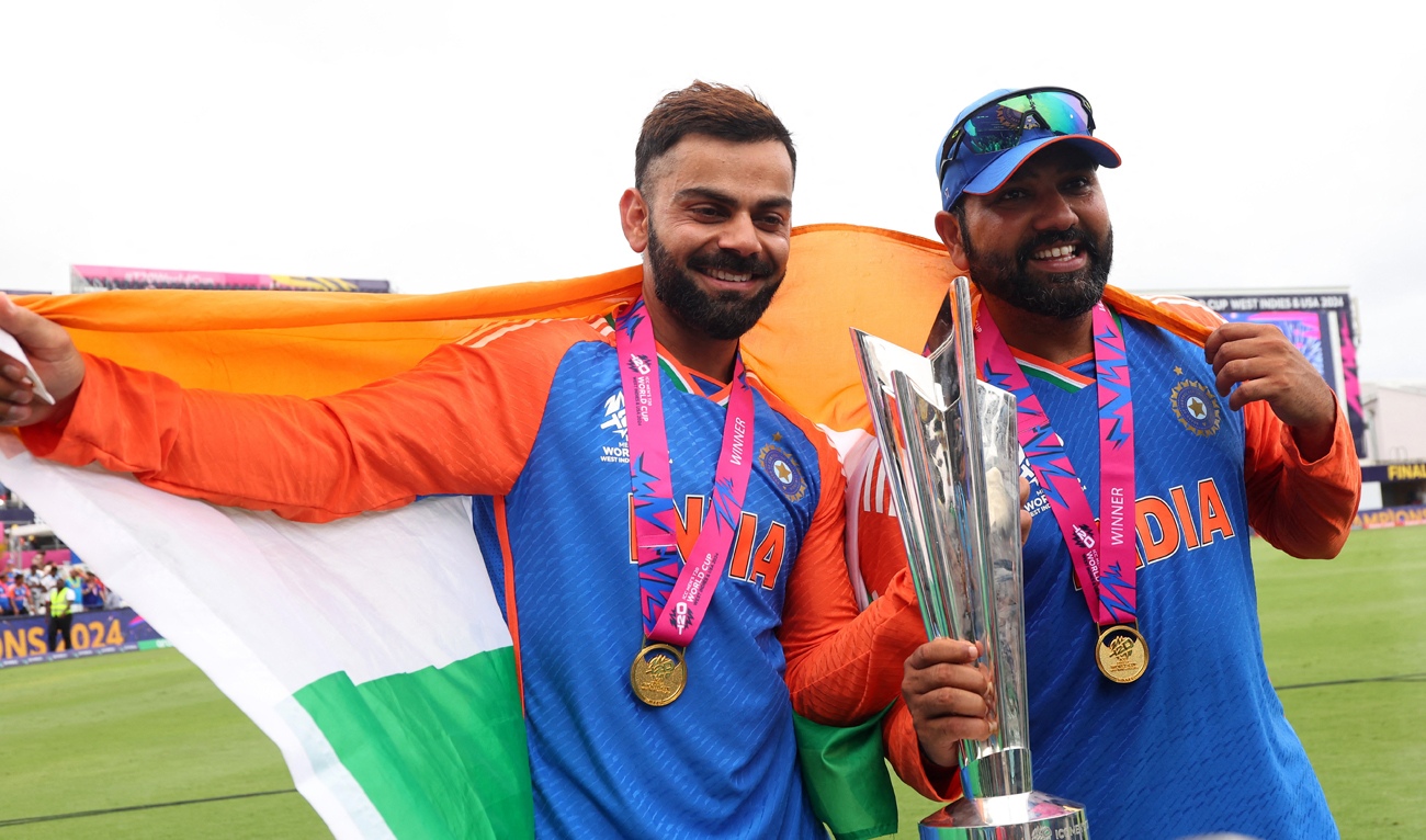 India’s Virat Kohli and Rohit Sharma celebrate with the trophy after winning the T20 World Cup at the Kensington Oval in Bridgetown, Barbados on June 29, 2024. (REUTERS)