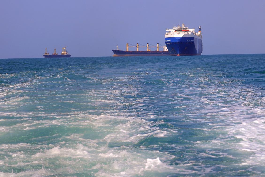 A picture taken during an organized tour by Yemen’s Houthi rebels on Nov. 22, 2023 shows the Galaxy Leader cargo ship, right, seized by Houthi fighters approaching the port in the Red Sea off Yemen’s province of Hodeidah. (AFP)