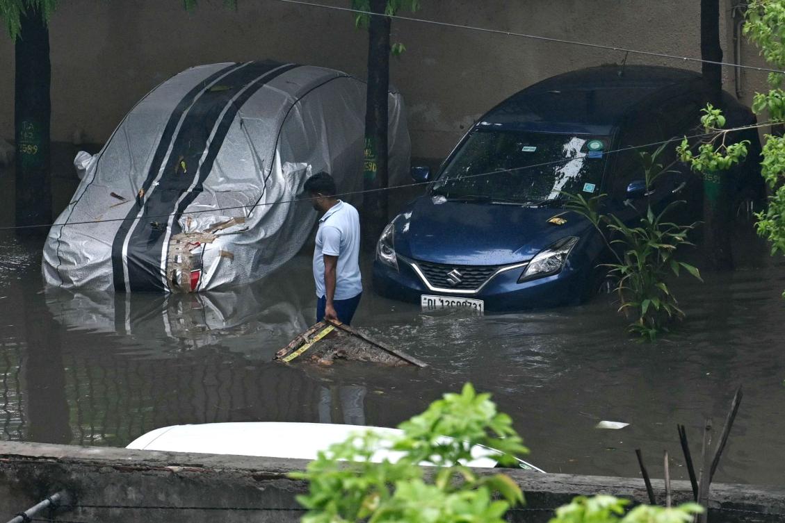 New Delhi faced the biggest downpour in decades on June 28, with rainfall in a single day surpassing the city’s average for the entire month. (AFP)