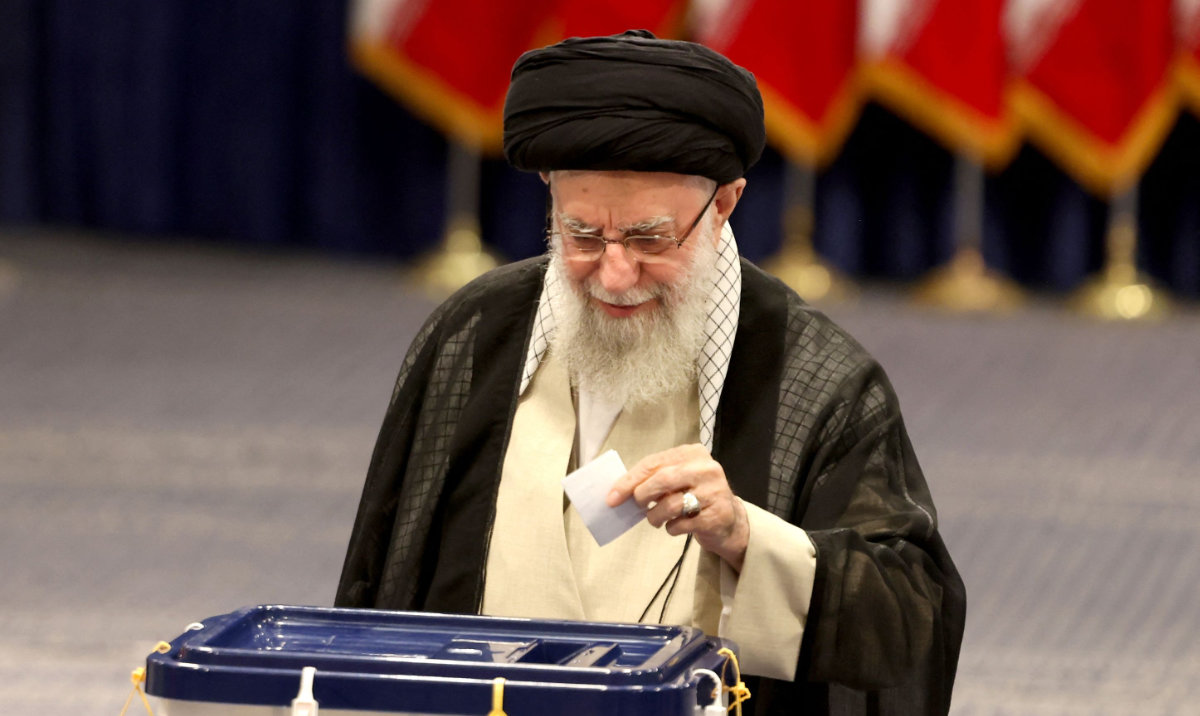 Iran's supreme leader Ayatollah Ali Khamenei, casts his ballot during the parliamentary runoff elections in Tehran. (AFP)