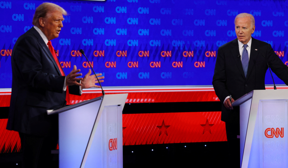 US President Joe Biden listens former US President Donald Trump speaks during their debate in Atlanta, June 27, 2024. (REUTERS)