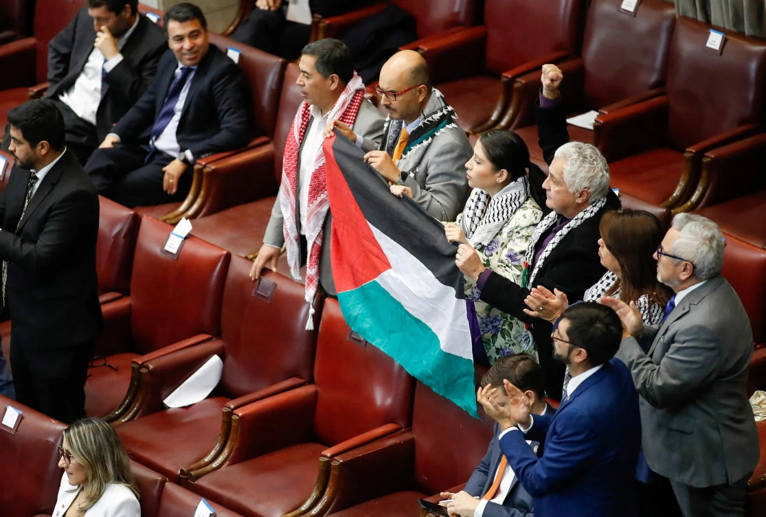 Parliamentarians hold up a Palestinian flag during the annual address of Chile's President Gabriel Boric at the National Congress in Valparaiso, Chile June 1, 2024. (Reuters)