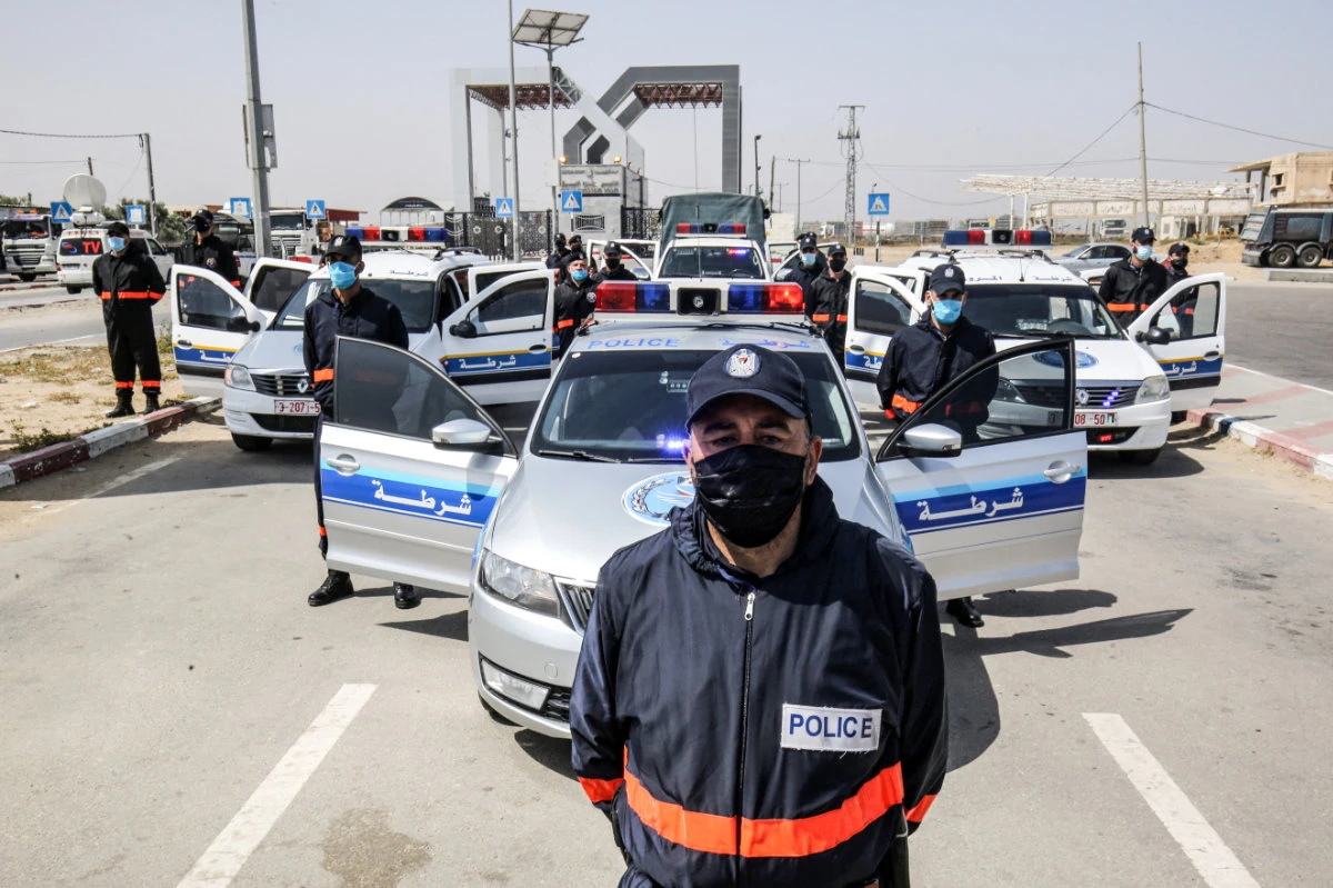 In this photo taken on May 12, 2020, Hamas security officers regulate entry at the Rafah border crossing with Egypt in the southern Gaza Strip amid the COVID-19 coronavirus pandemic. Israel seeks replace the deeply entrenched Hamas with an alternative local governing body for Gaza. (AFP)