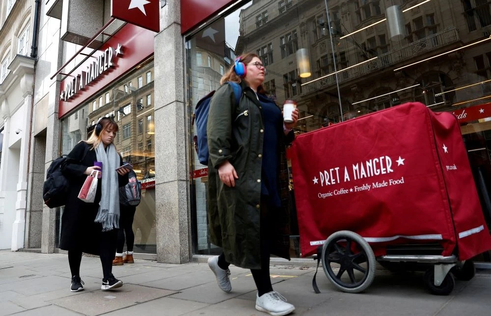 People walk past a Pret a Manger outlet in London, Britain, Mar. 2, 2023. (Reuters)