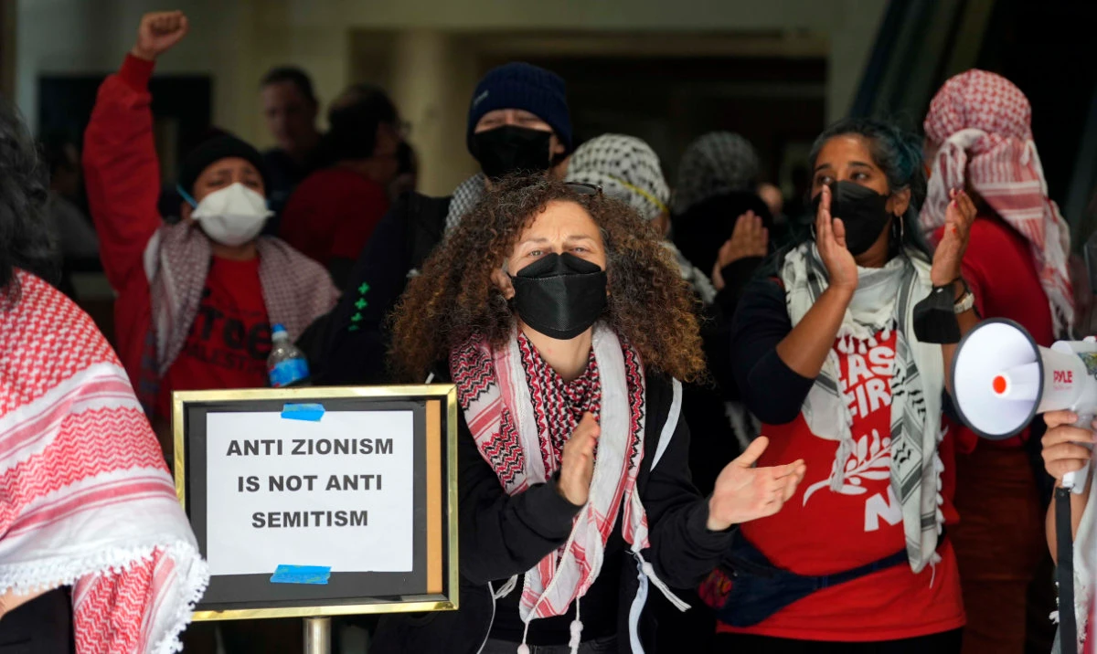 Pro-Palestinian demonstrators chant slogans while occupying the lobby of a building housing the Israeli Consulate in San Francisco on Monday, June 3, 2024. (AP)