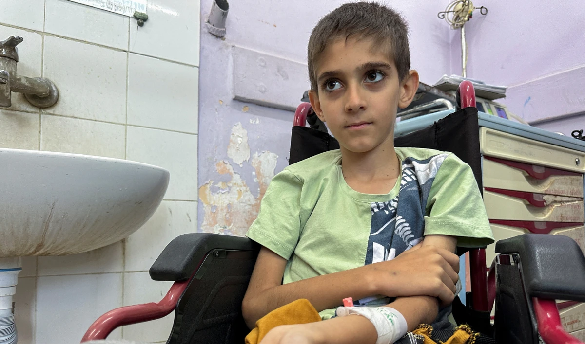 Siraj Yassin, a Palestinian boy with cancer, looks on as he receives treatment at Al-Aqsa hospital in central Gaza Strip on June 1, 2024. (Reuters).