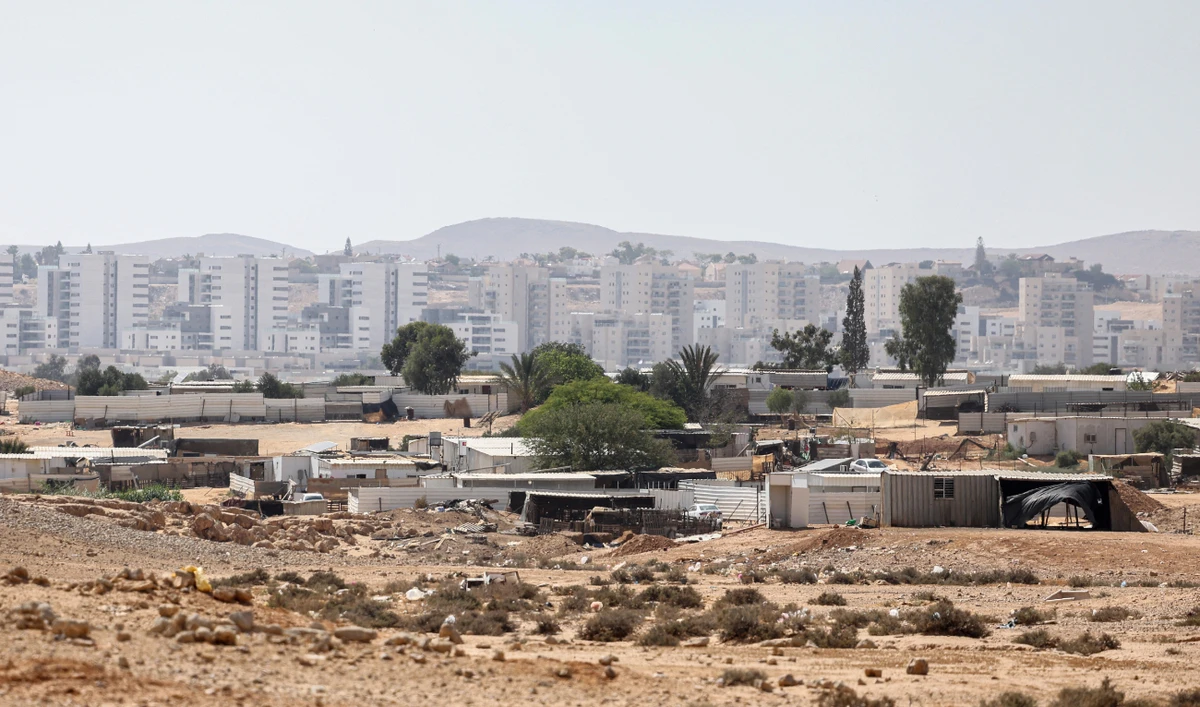 A picture shows the unrecognized Bedouin village of Ras Jrabah, east of Dimona city (background) in southern Israel, on May 29, 2024. (AFP)