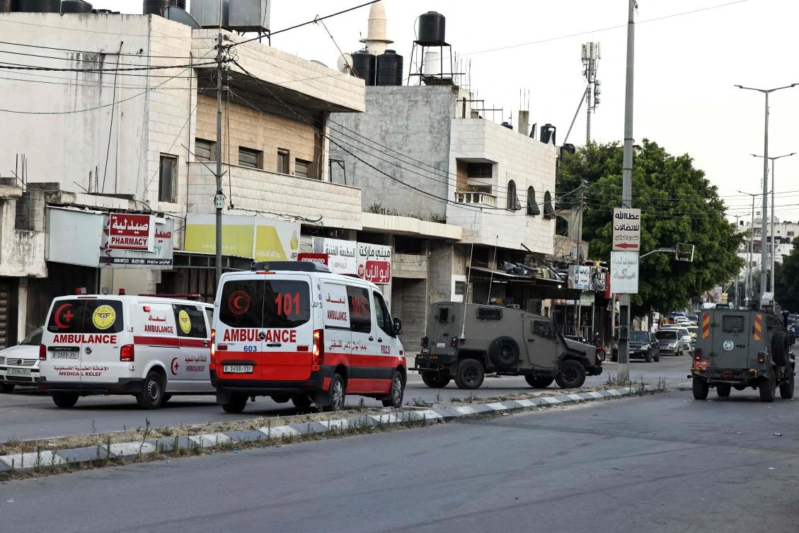 Palestinian ambulances are parked at the ready as clashes take place between Palestinian protesters and Israeli troops during a raid on the Balata refugee camp, in the Israeli occupied Palestinian West Bank. (File/AFP)
