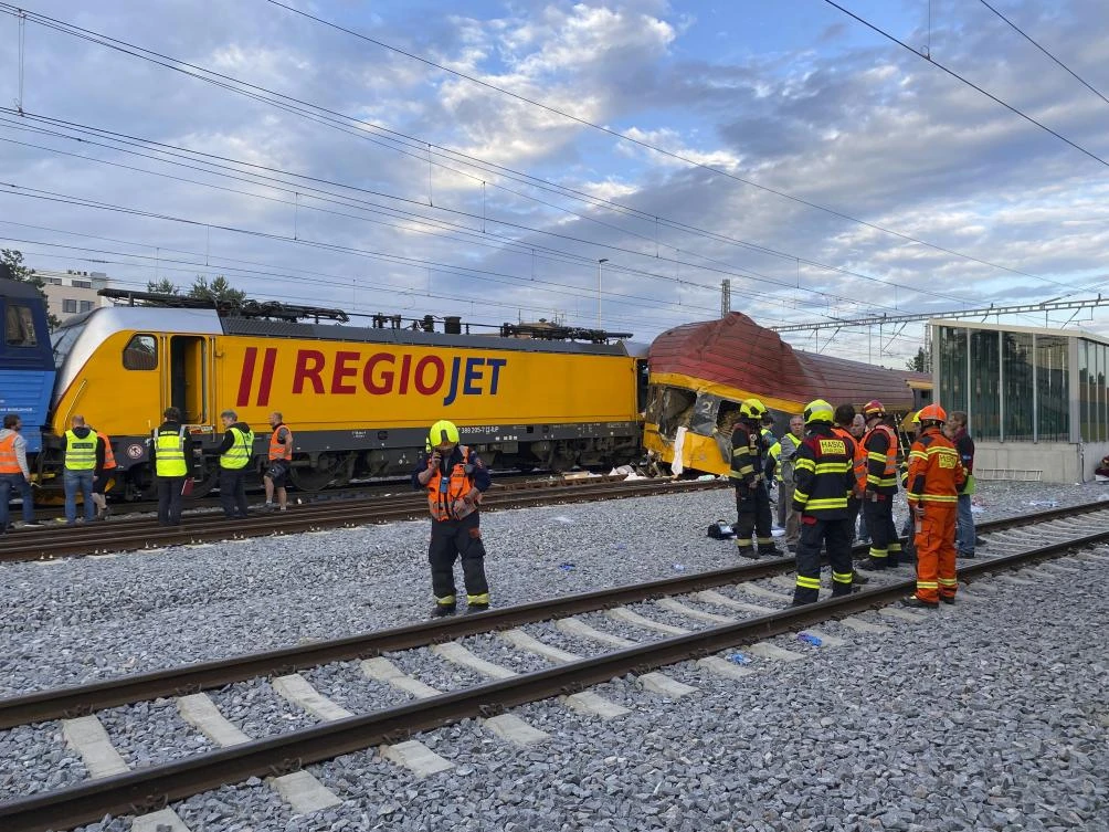 Firefighters stand by two trains that collided in Pardubice, Czech Republic on Jun. 6, 2024. (AP)
