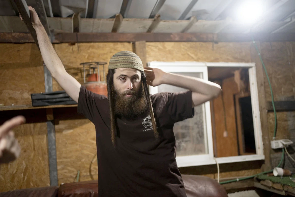 Elisha Yered, an Israeli settler and leading figure with the Hilltop Youth, at a makeshift clubhouse on a hilltop near the settlement of Maskiot in the northern West Bank on May 12, 2024. (AP Photo/Maya Alleruzzo)