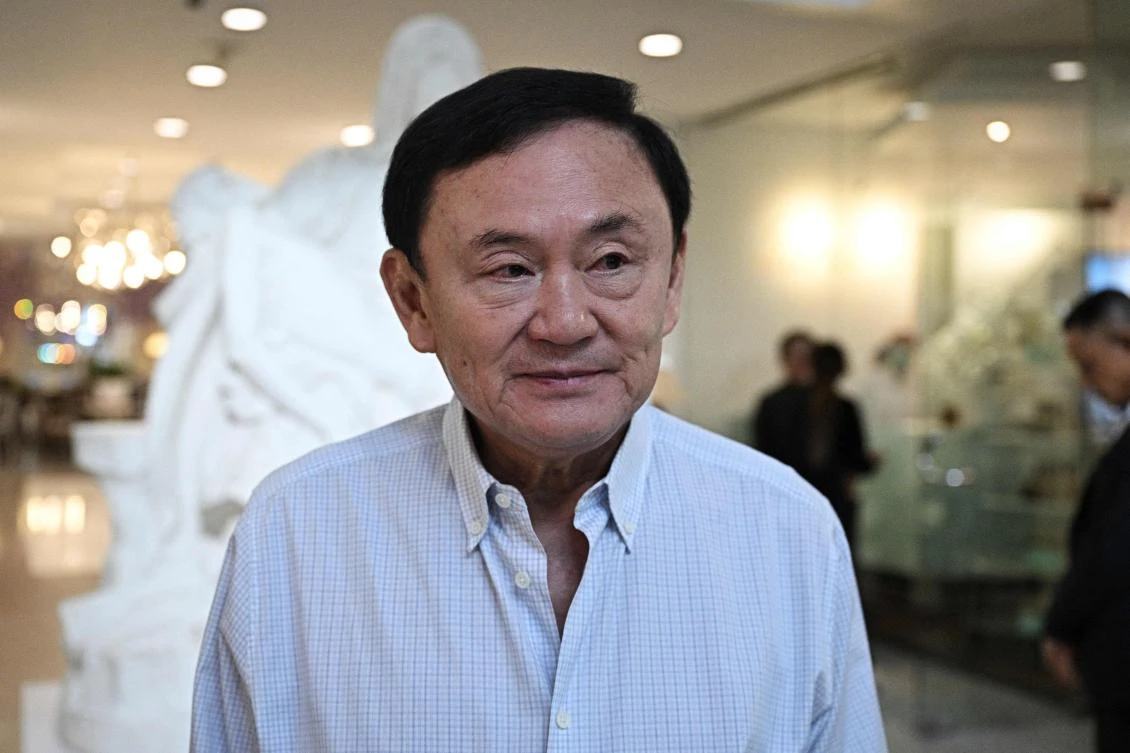 Thailand’s former prime minister Thaksin Shinawatra walks out from a beauty salon in Bangkok on Jun. 5, 2024. (AFP)