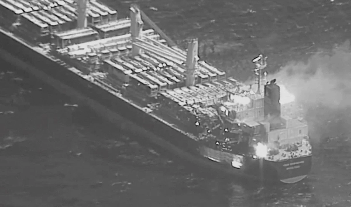 This file photo obtained from the US Central Command on March 6, 2024 shows a Barbados-flagged, Liberian-owned bulk carrier after it was hit by anti-ship ballistic missile launched by Yemen's Houthi militia. On Saturday, an Antigua and Barbuda-flagged cargo ship was reported hit Houthi missiles. (AFP/File)