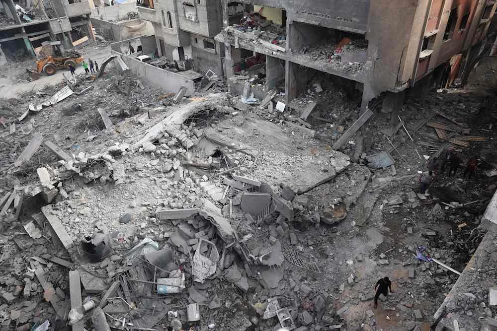 Palestinians inspect the damage and debris a day after an operation by the Israeli Special Forces in the Nuseirat camp, in the central Gaza Strip on June 9, 2024, amid the ongoing conflict between Israel and the Palestinian Hamas militant group. (AFP)