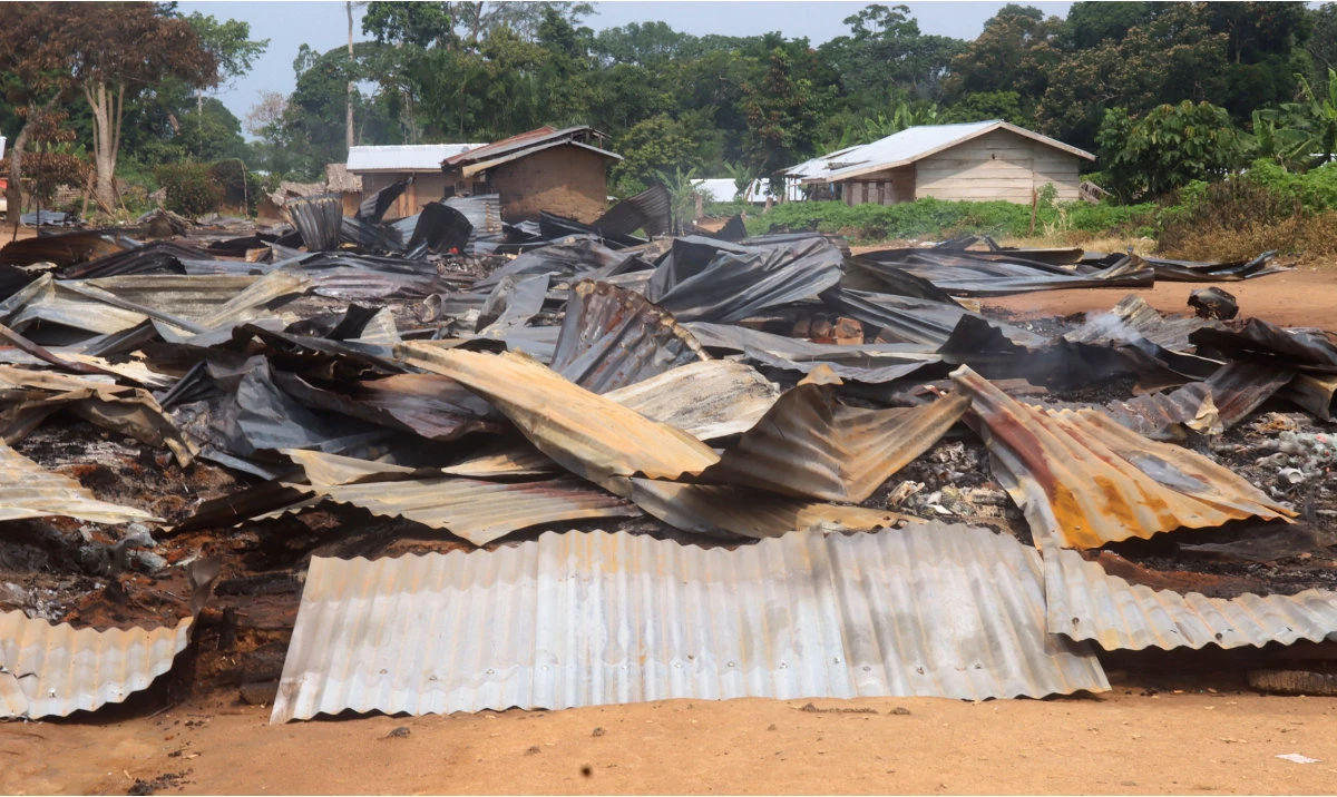 The ruins of market stalls smoulder following an attack by suspected Islamist rebels from the Allied Democratic Forces (ADF), within Masala village in Beni territory of eastern Democratic Republic of Congo June 9, 2024. (Reuters)