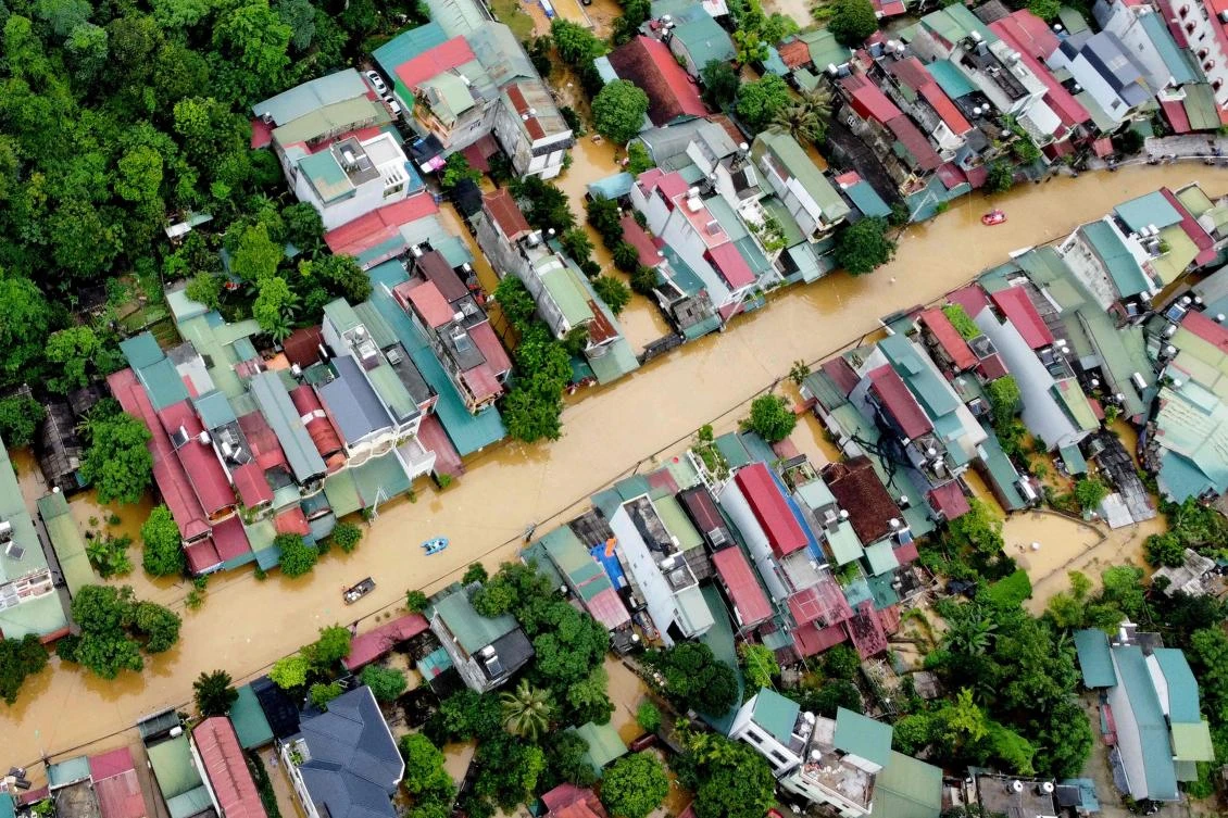 Flood waters submerged buildings after heavy rain in Ha Giang city in northern Vietnam on June 10, 2024. (AFP)