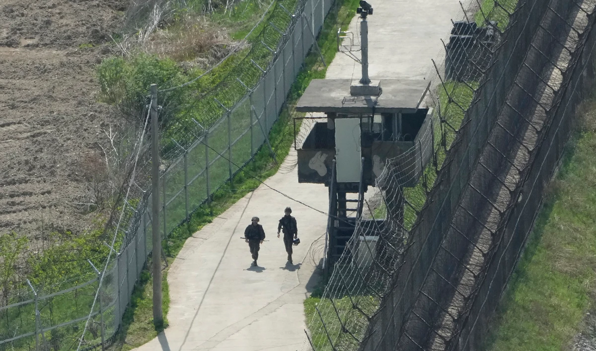 South Korean army soldiers patrol along the barbed-wire fence in Paju, South Korea, near the border with North Korea, on April 23, 2024. (AP/File)