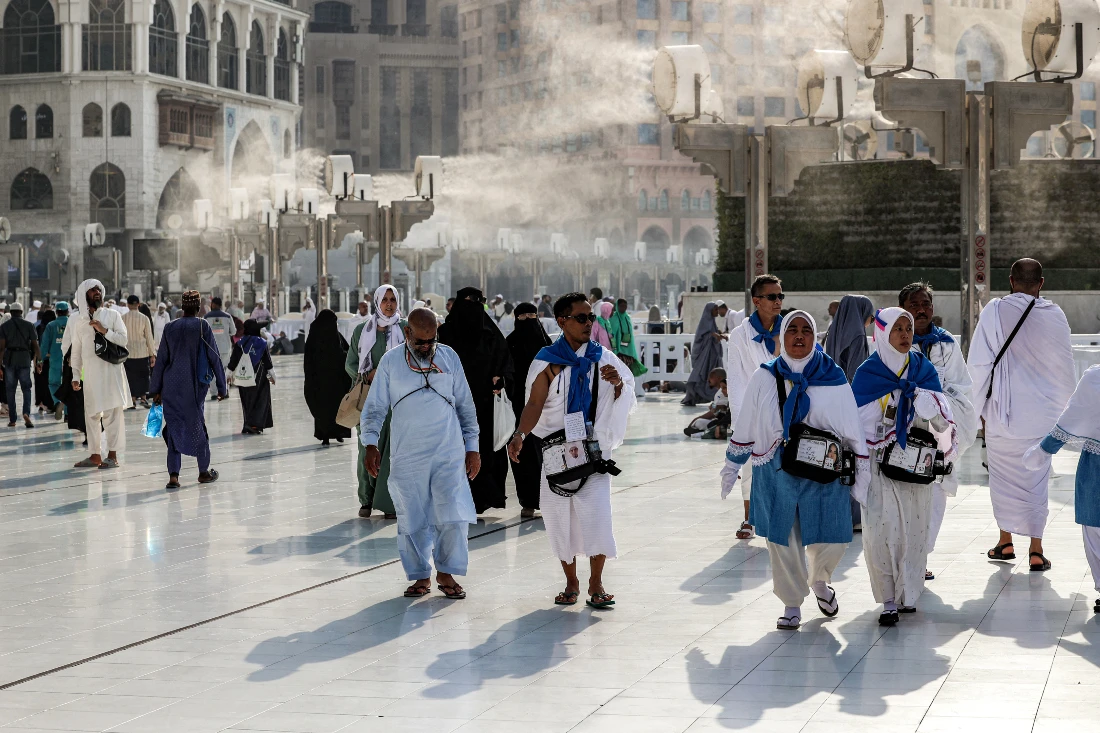 Fans blow air mixed with water vapour to cool off Muslim pilgrims walking at the Grand Mosque in Saudi Arabia's Makkah ahead of an expected hot Hajj season. (File/AFP)
