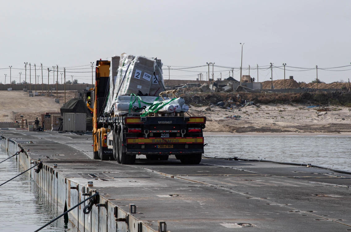 A truck carries humanitarian aid across Trident Pier, a temporary pier to deliver aid, off the Gaza Strip, amid the ongoing conflict between Israel and the Palestinian Islamist group Hamas, near the Gaza coast. (File/Reuters)
