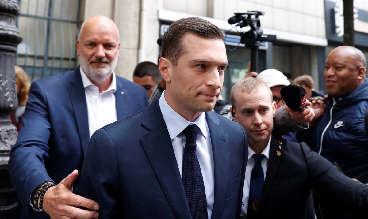Jordan Bardella, President of the French far-right National Rally (Rassemblement National - RN) party, leaves the RN party headquarters in Paris, as French political parties try to build alliances ahead of early legislative elections in France, June 11, 2024. (Reuters)
