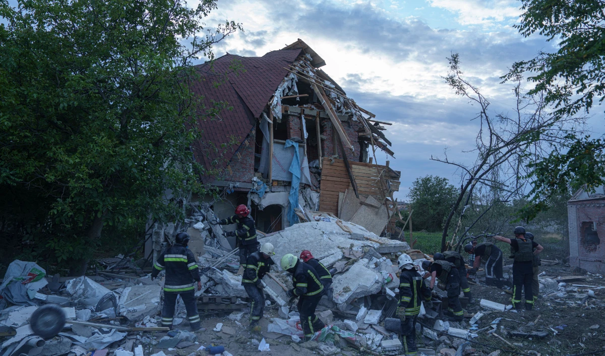 Rescue workers clear the rubble of a building which was destroyed by a Russian airstrike in Kharkiv, Ukraine, Monday, June 10, 2024. (AP)