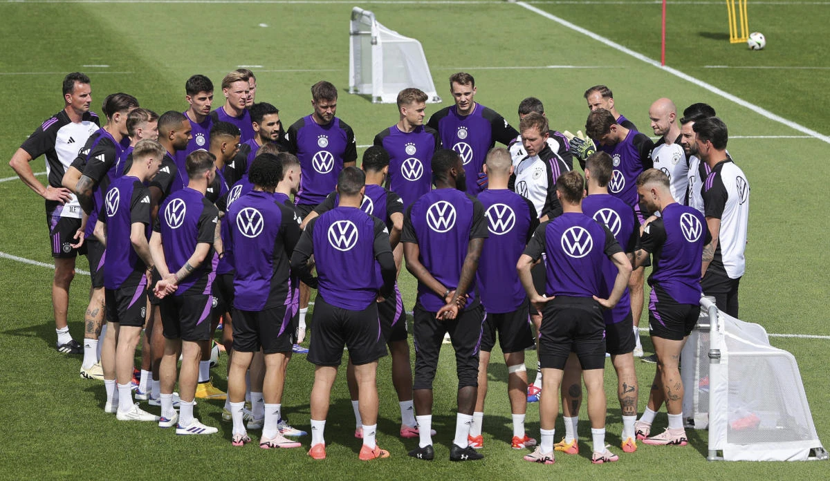 Germany national team, players and coaches stand together in a circle during a public training in Herzogenaurach, Germany, on Jun. 10, 2024. (AP)