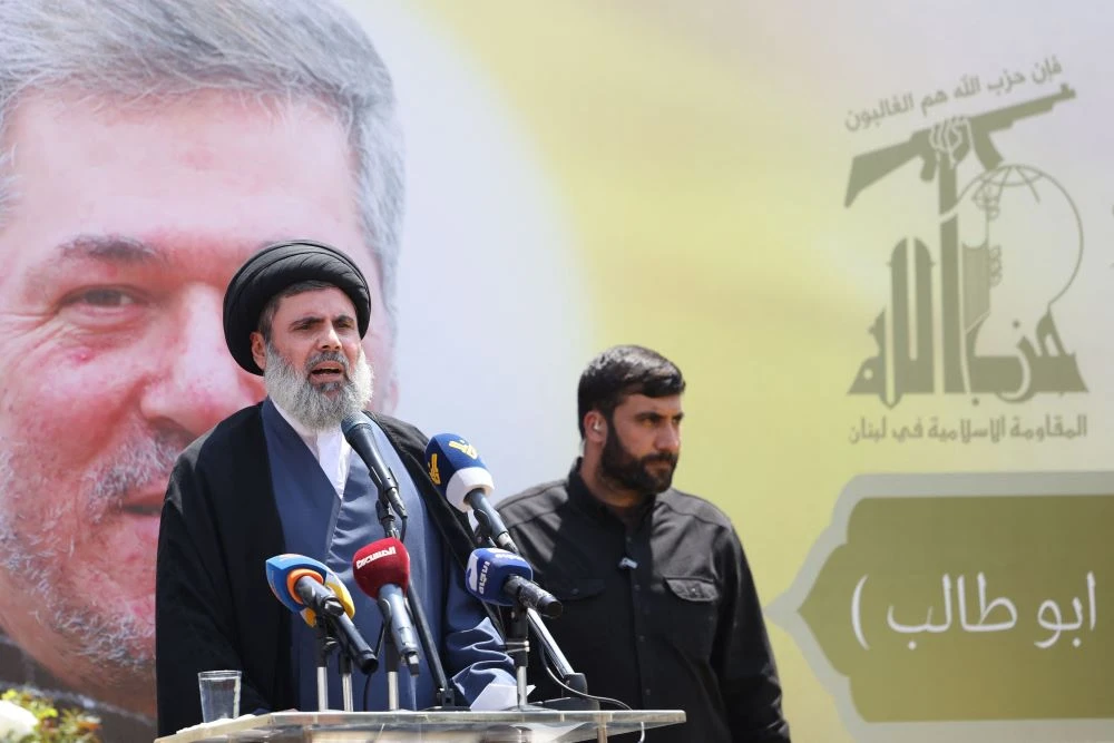 Senior Hezbollah official Hashem Safieddine addresses mourners during the funeral of Taleb Sami Abdullah, also known as Abu Taleb, during his funeral in Beirut’s southern suburbs, June 12, 2024. (AFP)