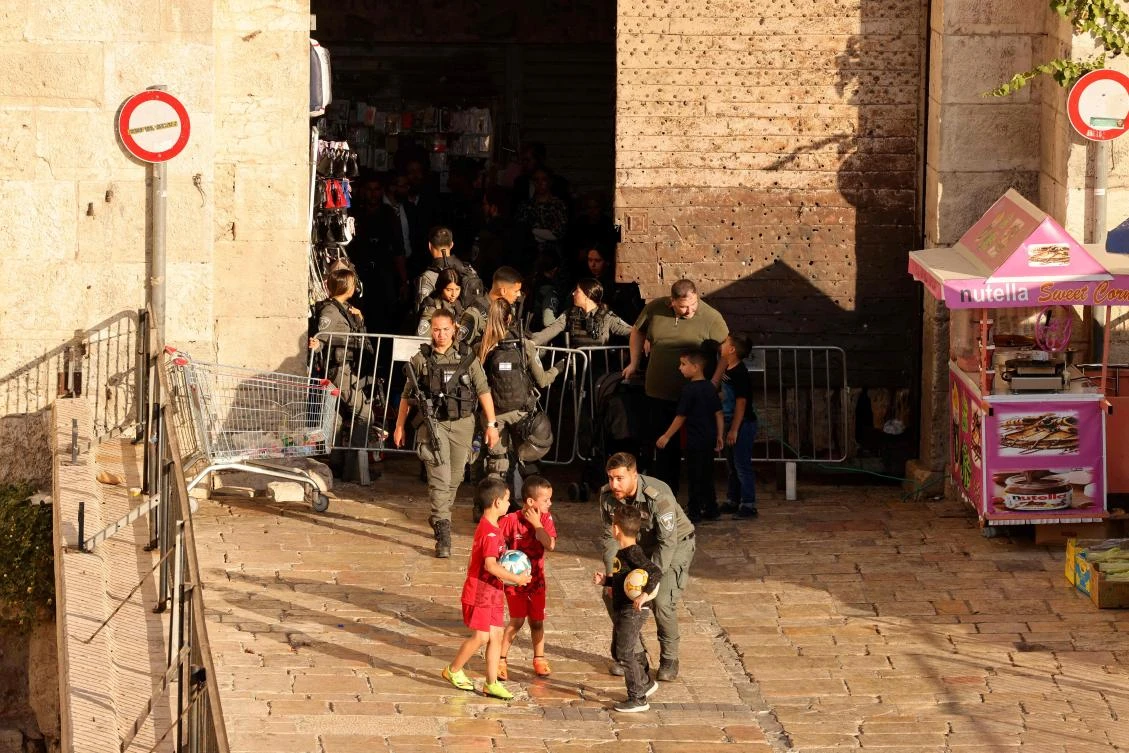 Israeli soldiers stand guard in front of the Damascus Gate after a Palestinian man was seriously wounded in a shooting incident in annexed east Jerusalem’s Old City during “a quarrel” between off-duty soldiers and Palestinians, on Jun. 12, 2024. (AFP)