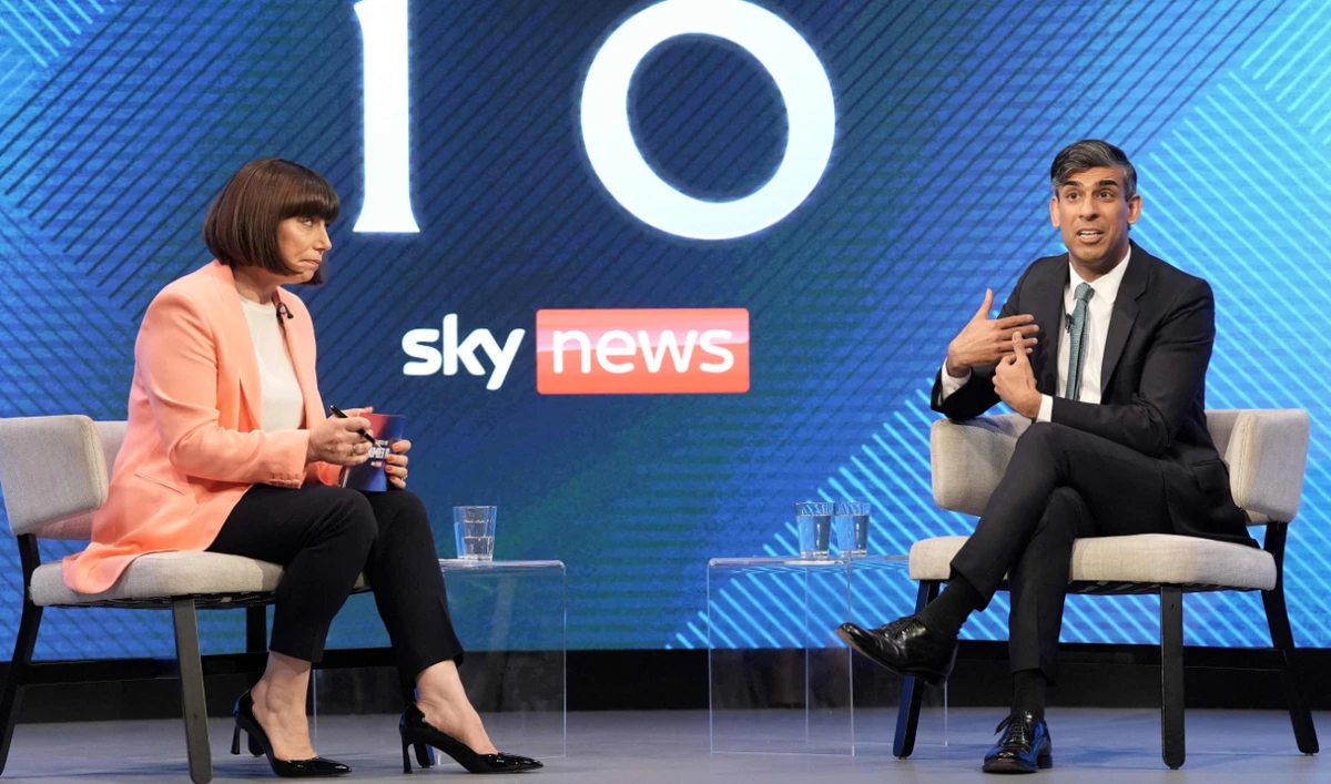 Britain’’s Prime Minister and Conservative Party leader Rishi Sunak speaks with Sky’s political editor Beth Rigby during a Sky News election event in Grimsby, northeast England, on June 12, 2024. (AFP)