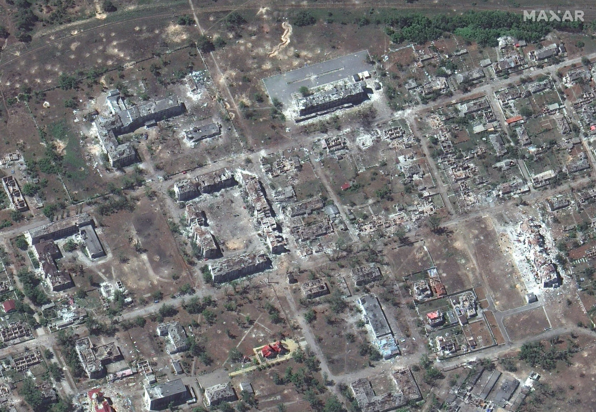 This satellite image released by Maxar Technologies shows buildings destroyed in Rubizhne, Ukraine, amid Russia's invasion. Carbon dioxide emissions are expected to jump drastically when Ukraine starts reconstruction work. (AFP)