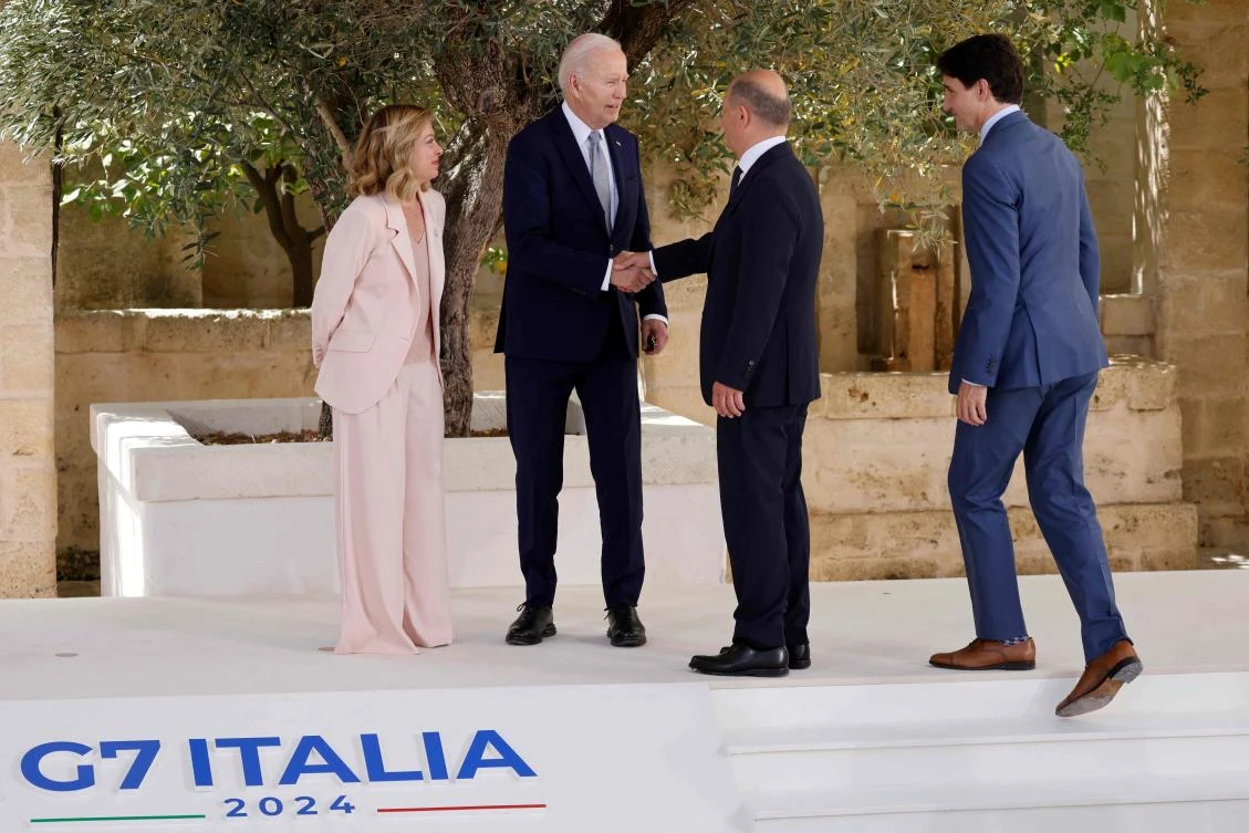 US President Joe Biden shakes hands with German Chancellor Olaf Scholz as Italy’s Prime Minister Giorgia Meloni and Canadian Prime Minister Justin Trudeau look on upon arrival at the Borgo Egnazia resort for the G7 Summit hosted by Italy on Jun. 13, 2024. (AFP)