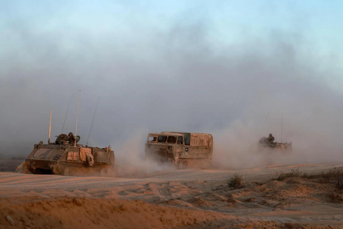 Israeli military armored vehicles roll in an area bordering the Gaza Strip on Jun. 9, 2024, amid the ongoing conflict between Israel and the Palestinian Hamas militant group. (AFP)