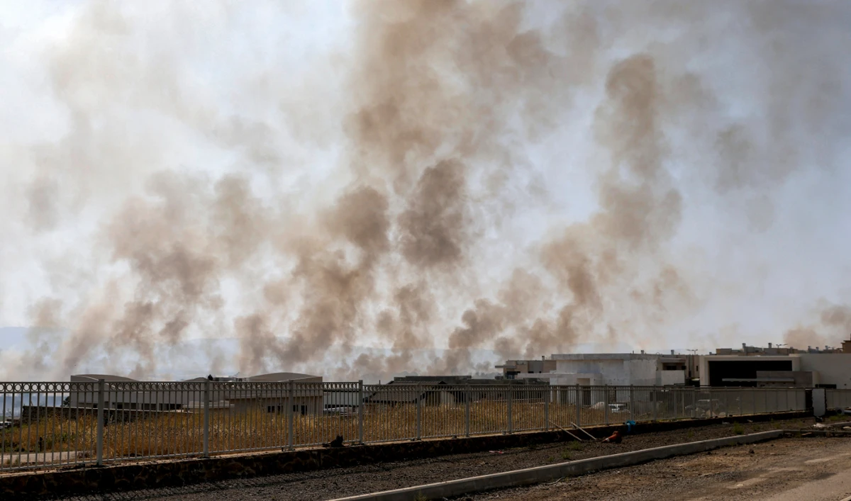 Smoke plumes rise from a fire in a field after rockets launched from southern Lebanon landed near Katzrin in the Israel-annexed Golan Heights on June 13, 2024. (AFP)