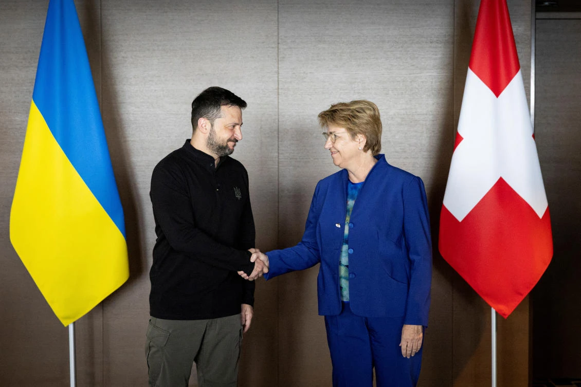 Ukrainian President Volodymyr Zelensky and Swiss Federal President Viola Amherd shake hands during the Summit on peace in Ukraine, in Stansstad near Lucerne, Switzerland on Jun. 15, 2024. (Reuters)