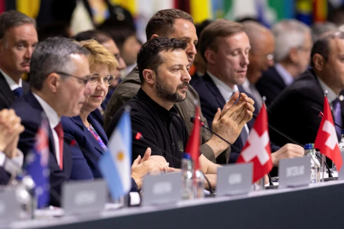 Ukrainian President Volodymyr Zelensky, center, leads other officials during the plenary session of the Summit on Peace in Ukraine in Stansstad near Lucerne, Switzerland on June 16, 2024. (Reuters)