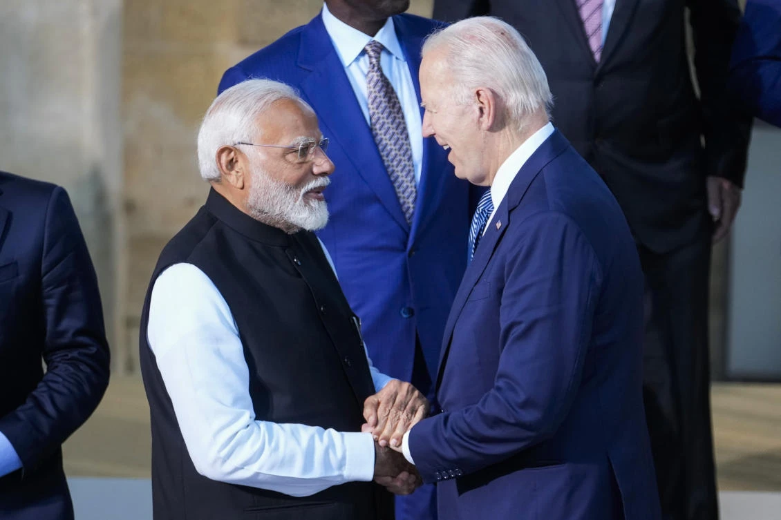 Indian Prime Minister Narendra Modi, left, talks to US President Joe Biden prior a group photo at the G7 in Borgo Egnazia, near Bari in southern Italy, Friday, June 14, 2024. (AP)
