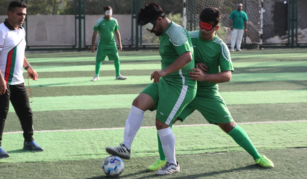 Members of Iraq's first national football team for the visually impaired, train at a sports club in Baghdad on May 22, 2024. (AFP)