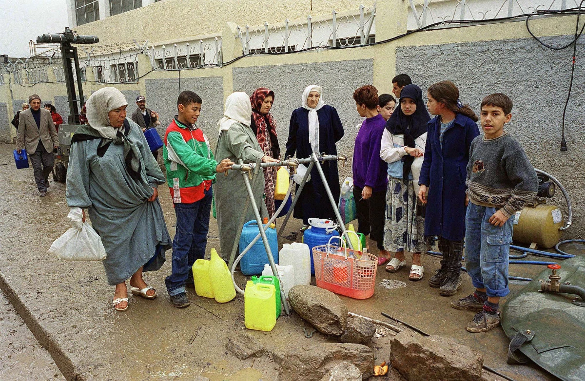 File photo showing Algerians queueing up for water in Bab El-oued, a district of the capital Algiers. Some places in Algeria are currently facing severe shortages of drinking water. (AFP)
