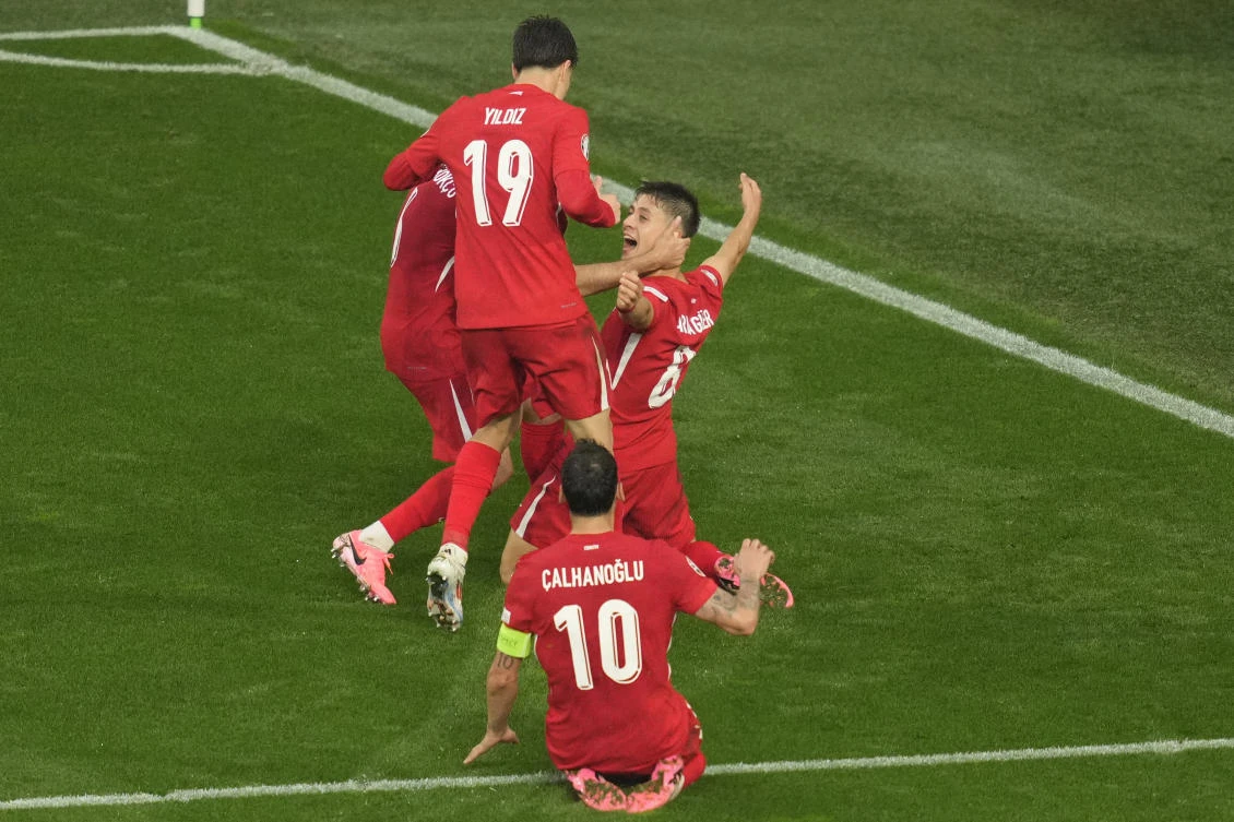 Turkiye’s Arda Guler, rear right, celebrates after scoring his side’s second goal during their Group F match against Georgia at the Euro 2024 tournament in Dortmund on Jun. 18, 2024. (AP)